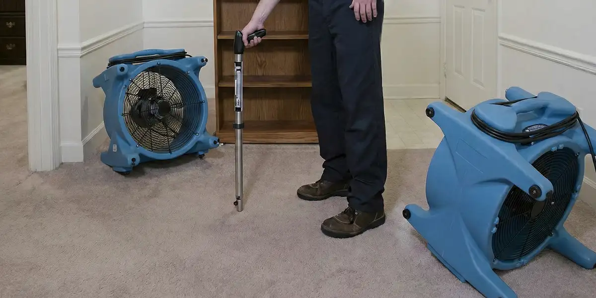emergency water removal equipment deployed to dry a flooded residential interior in Austin, TX