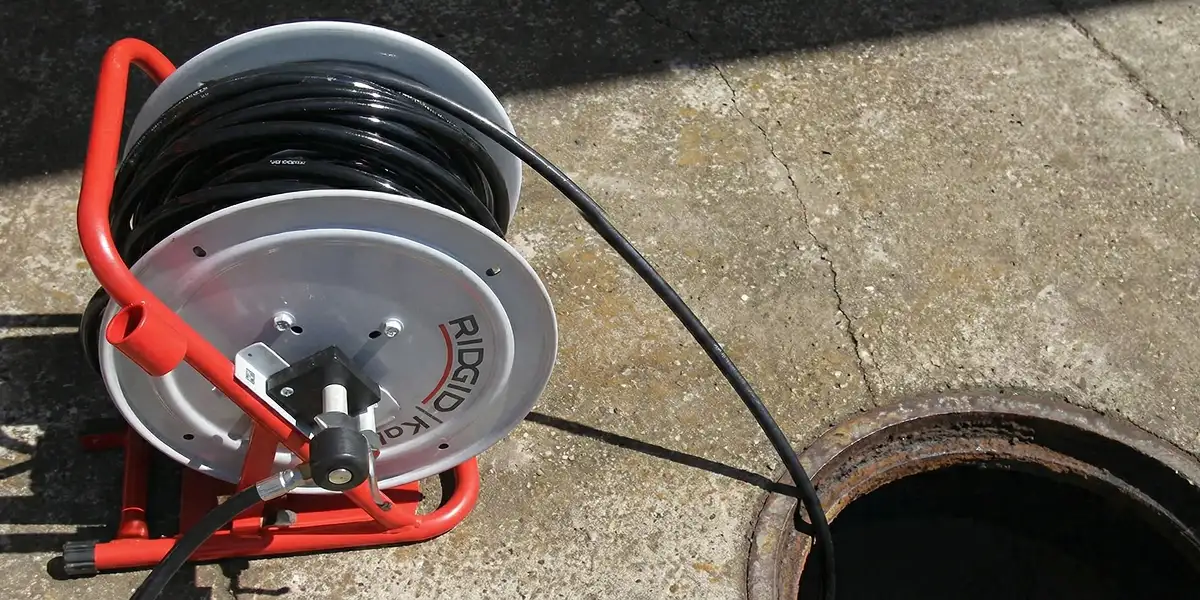 sewer rodding equipment prepared to clear clogged sewer lines in Austin, TX