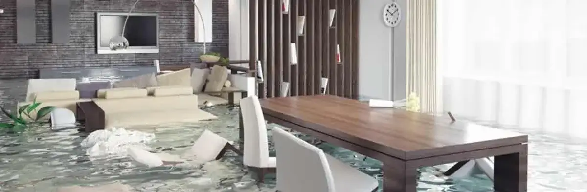 home interior affected by water damage with flooded floors and displaced furniture in Austin, TX